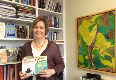 Every photo op is a publicity op! Ruth made quick decisions for which books to hold and display behind her. 