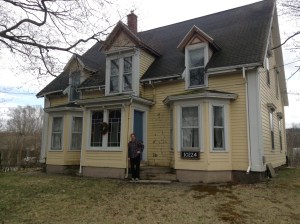 Andy Brown in front of his centuries old home. 